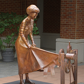 statue of woman with torn dress
