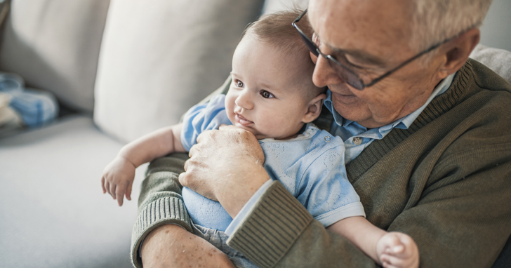 Grandfather holds baby how much life insurance do I need