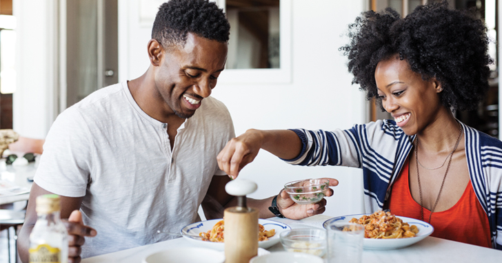 Couple enjoys breakfast of cereal together
