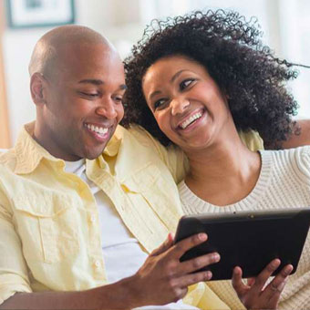 couple using tablet for online banking