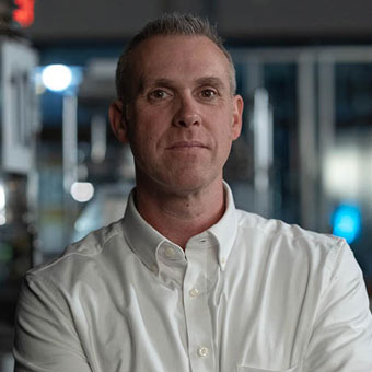 Kevin Lacassin standing in kitchen